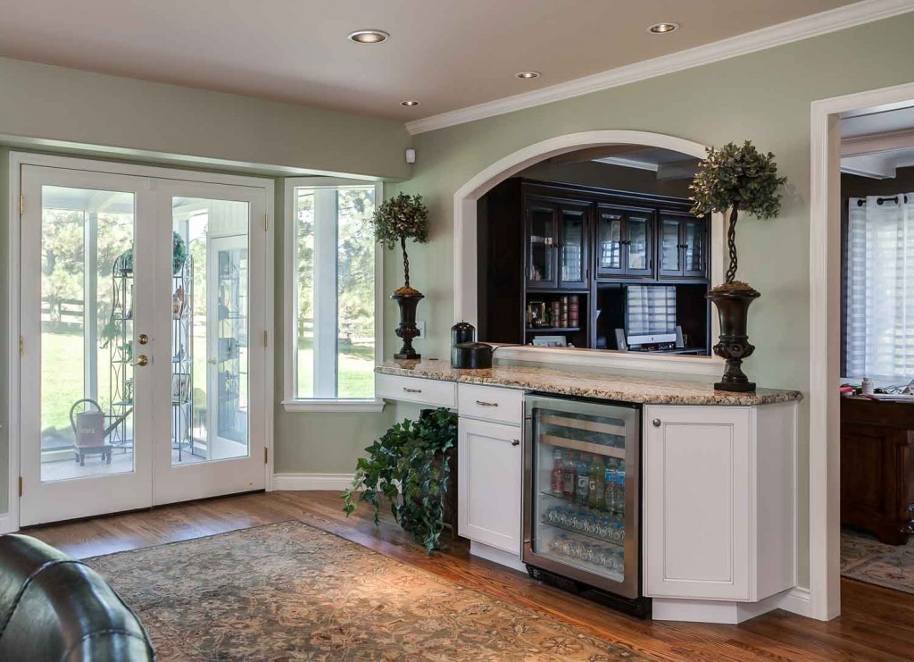 extra wet bar and beverage refrigerator in this open great room