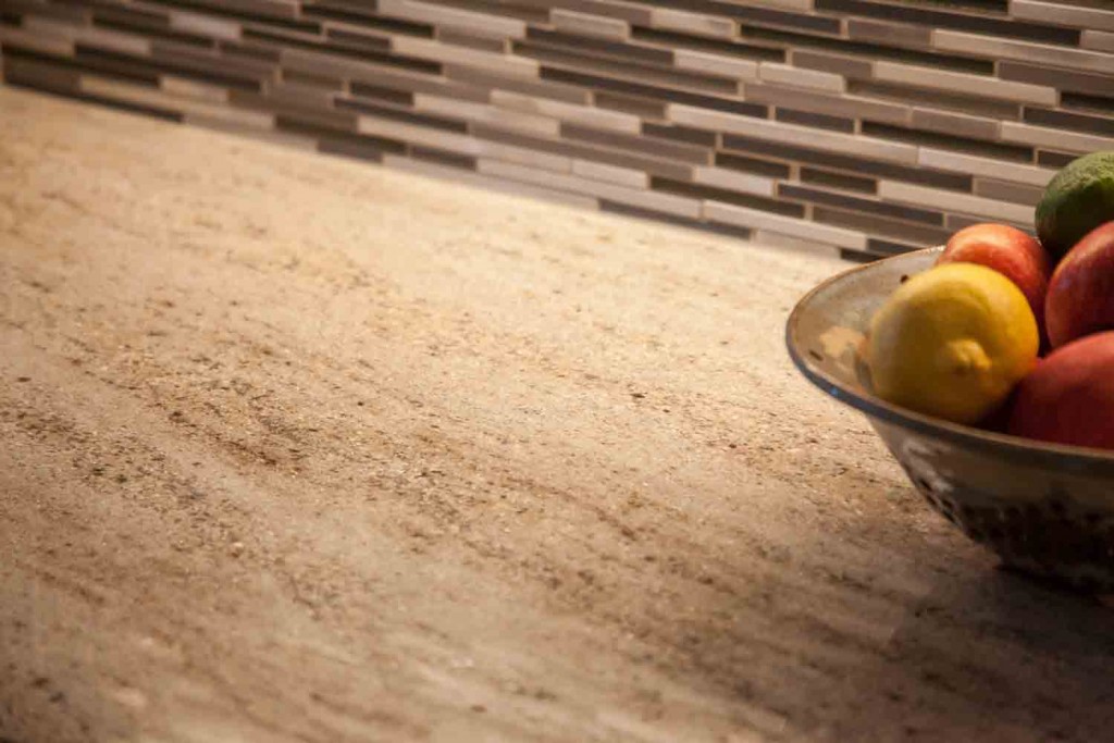 close up of granite countertop and glass subway tile backsplas in the remodel in cherry creek colorado