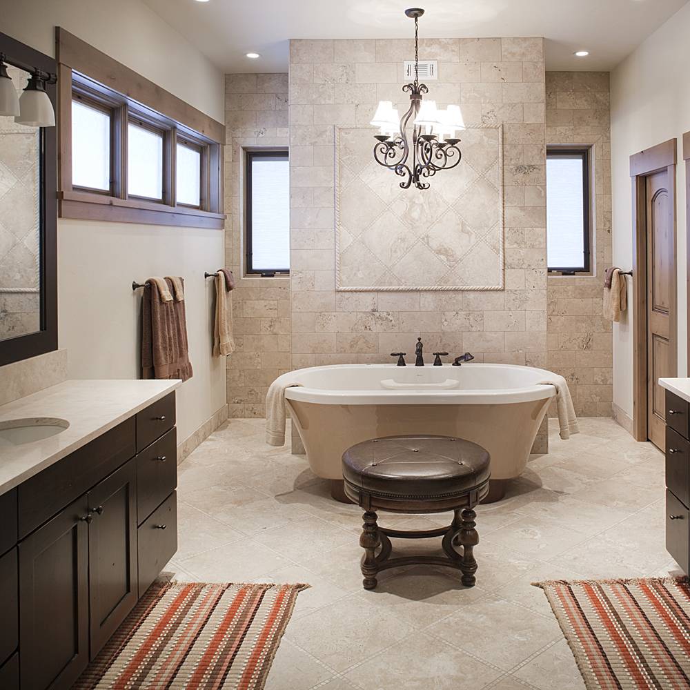 Full custom bathroom with claw foot tub, custom lighting and his and hers sinks.