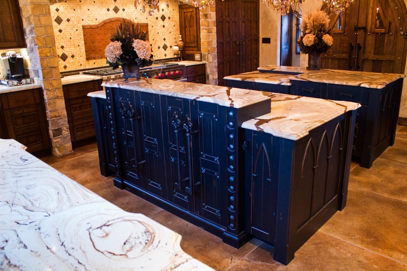 Painted black cabinets in this beautiful custom kitchen by Homestead Cabinetry