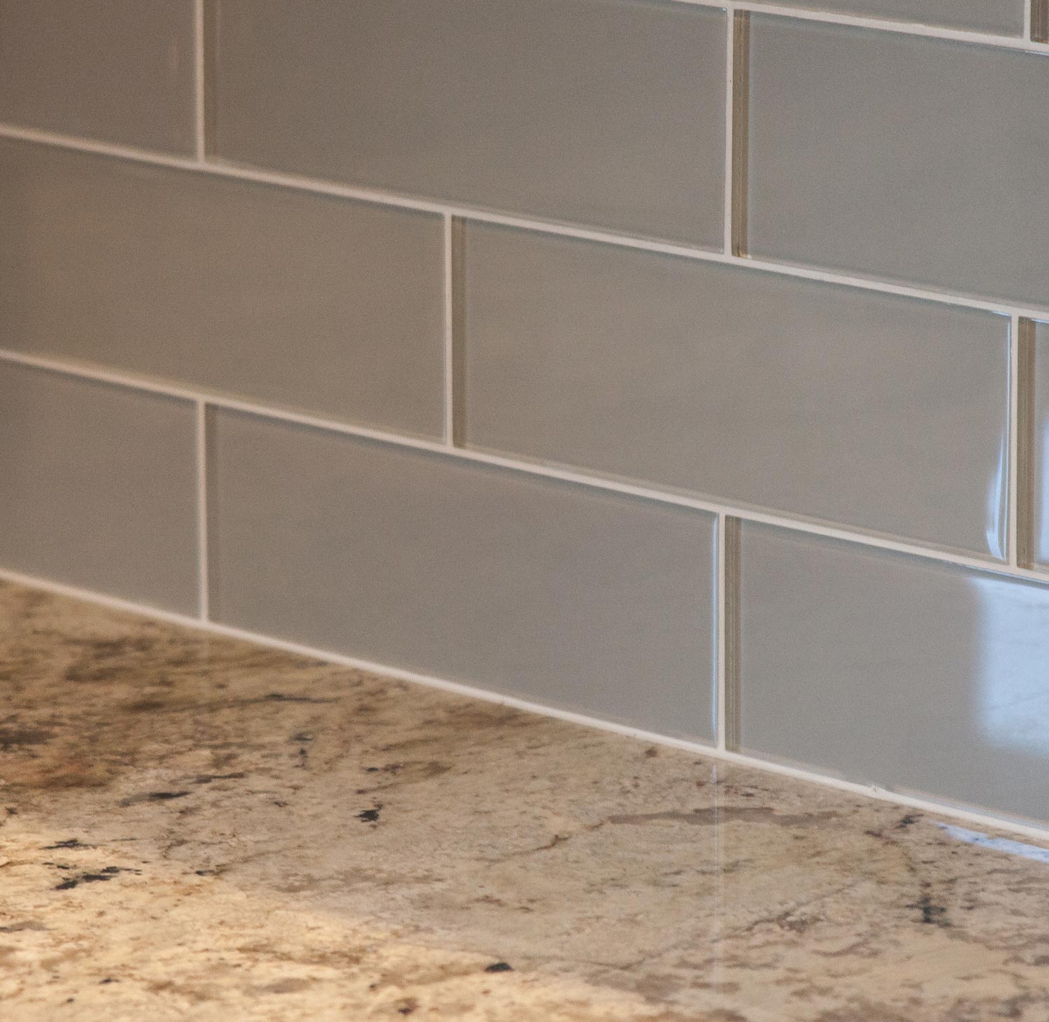 Castle Rock Builder Spec home with center island kitchen design features subway tile and farm sink.