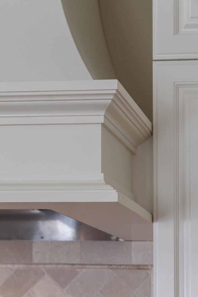 detail of white stove hood in this denver greenwood village kitchen remodel