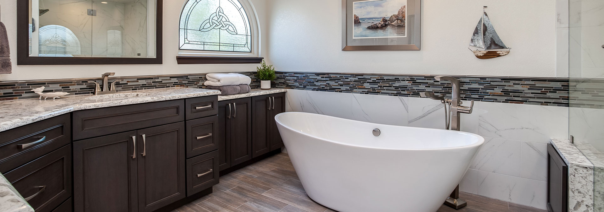 remodeled bathroom from JM Kitchen & Bath Design featuring soaking tub and plenty of counter space