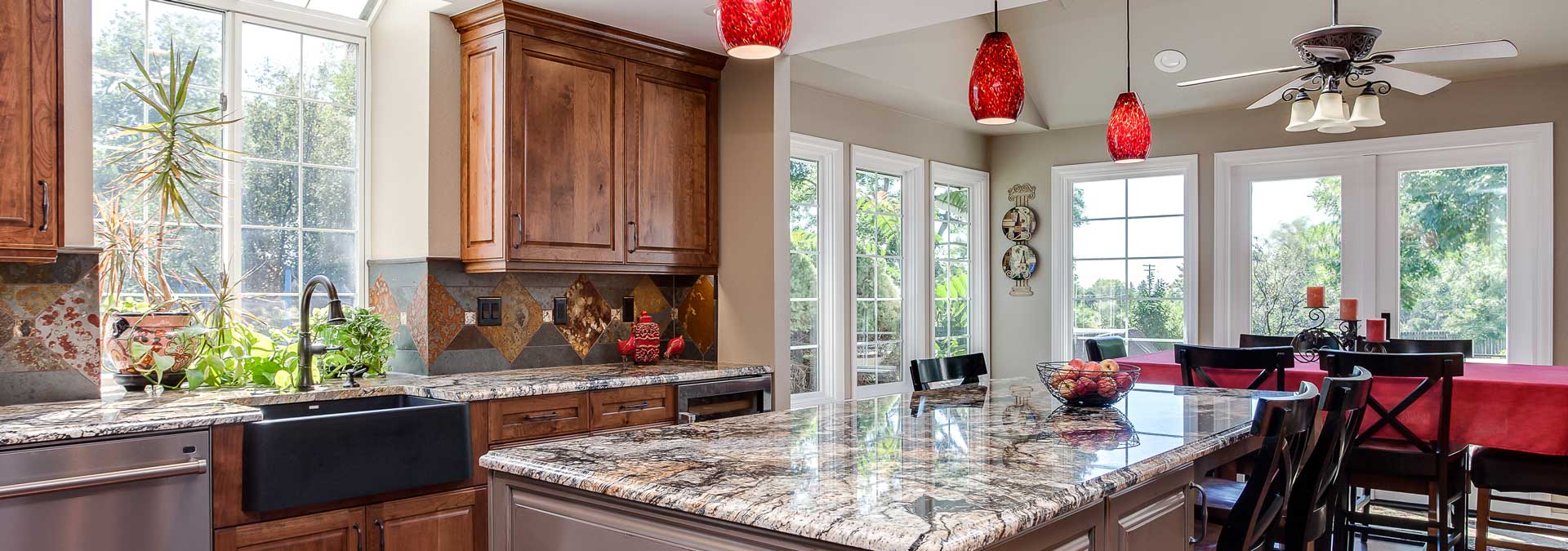 kitchen remodel with hints of maroon JM Kitchen & Bath Design