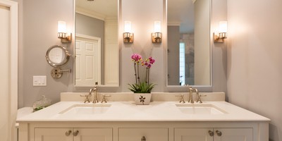 bathroom update includes double vanity, new faucets, and more lighting JM Kitchen & Bath Design