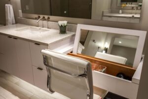 modern bathroom remodel featuring angle edges and makeup vanity JM Kitchen & Bath Design