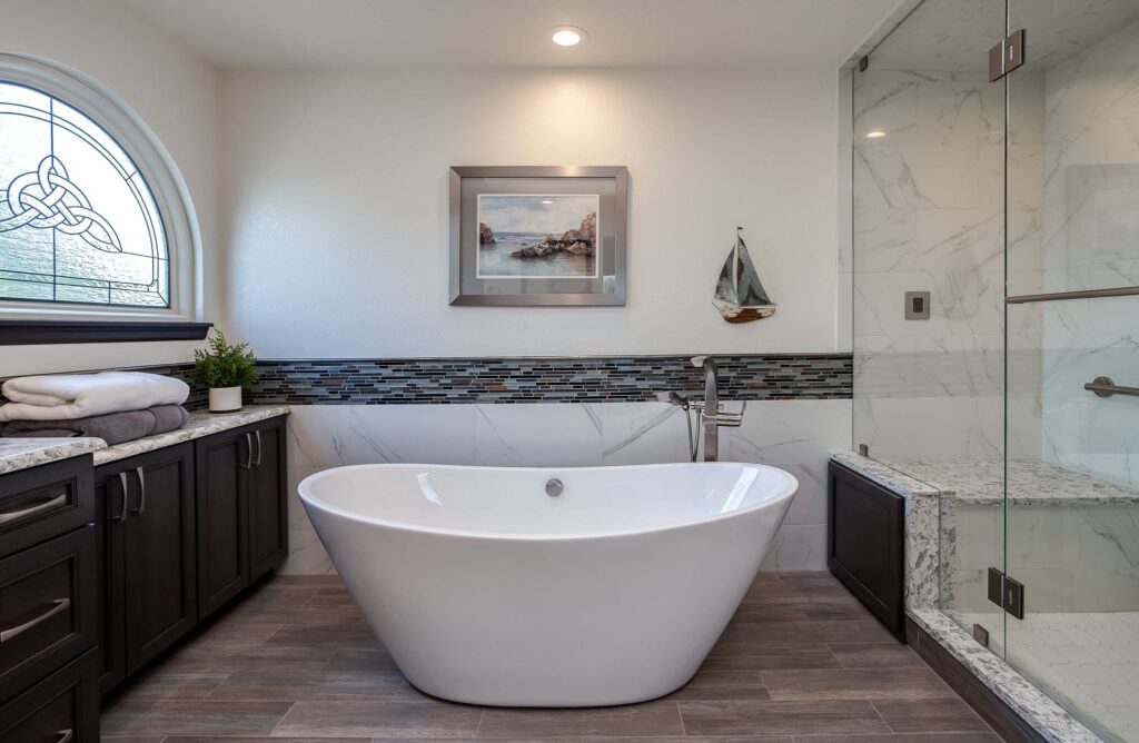 modern bathroom remodel featuring freestanding tub and walk-in shower with large bench JM Kitchen & Bath Design