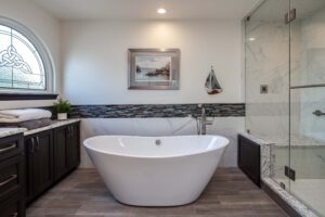 modern bathroom remodel featuring freestanding tub and walk-in shower with large bench JM Kitchen & Bath Design