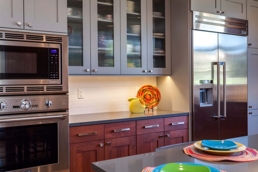 modern kitchen remodel with gray and dark wood finished cabinets with updated hardware JM Kitchen & Bath Design