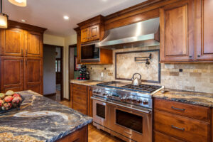 granite countertops, Wolf appliance, and updates cabinets are features of kitchen remodel JM Kitchen & Bath Design