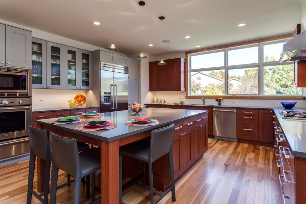 large kitchen remodel has lots of storage space and large windows bringing in natural light JM Kitchen & Bath Design