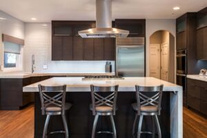 ultra modern kitchen remodel featuring 90 degree edges and white tile backsplash JM Kitchen & Bath Design