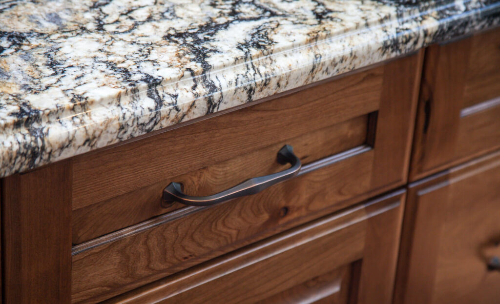 close up of cabinet drawer with distressed finish JM Kitchen & Bath Design