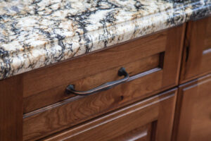 close up of cabinet drawer with distressed finish JM Kitchen & Bath Design