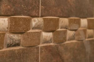 close up of bathroom tile accent work of brown and gray JM Kitchen & Bath Design