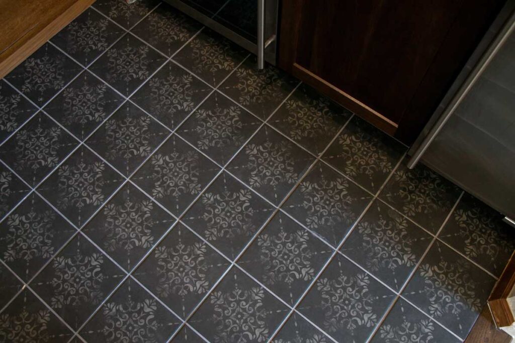 dark gray tile with filigree design JM Kitchen & Bath Design