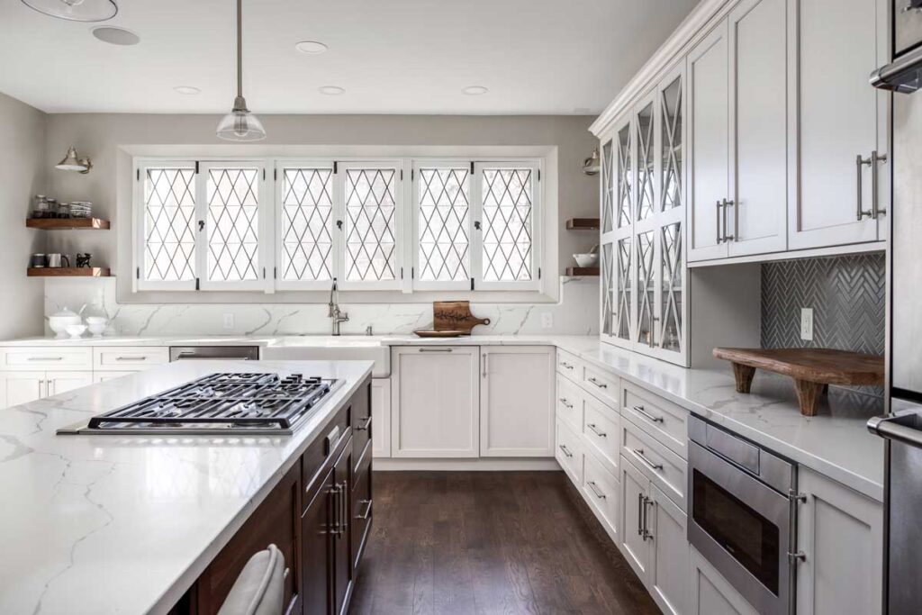 kitchen remodel features white cabinets and brushed nickel hardware JM Kitchen & Bath Design