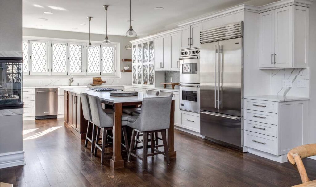 cabinet space and windows are featured in white kitchen remodel JM Kitchen & Bath Design