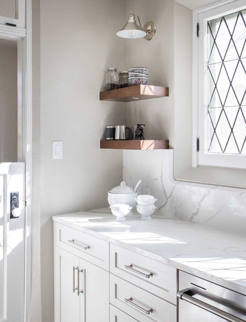 wood shelves in corner of remodeled light gray and white kitchen JM Kitchen & Bath Design