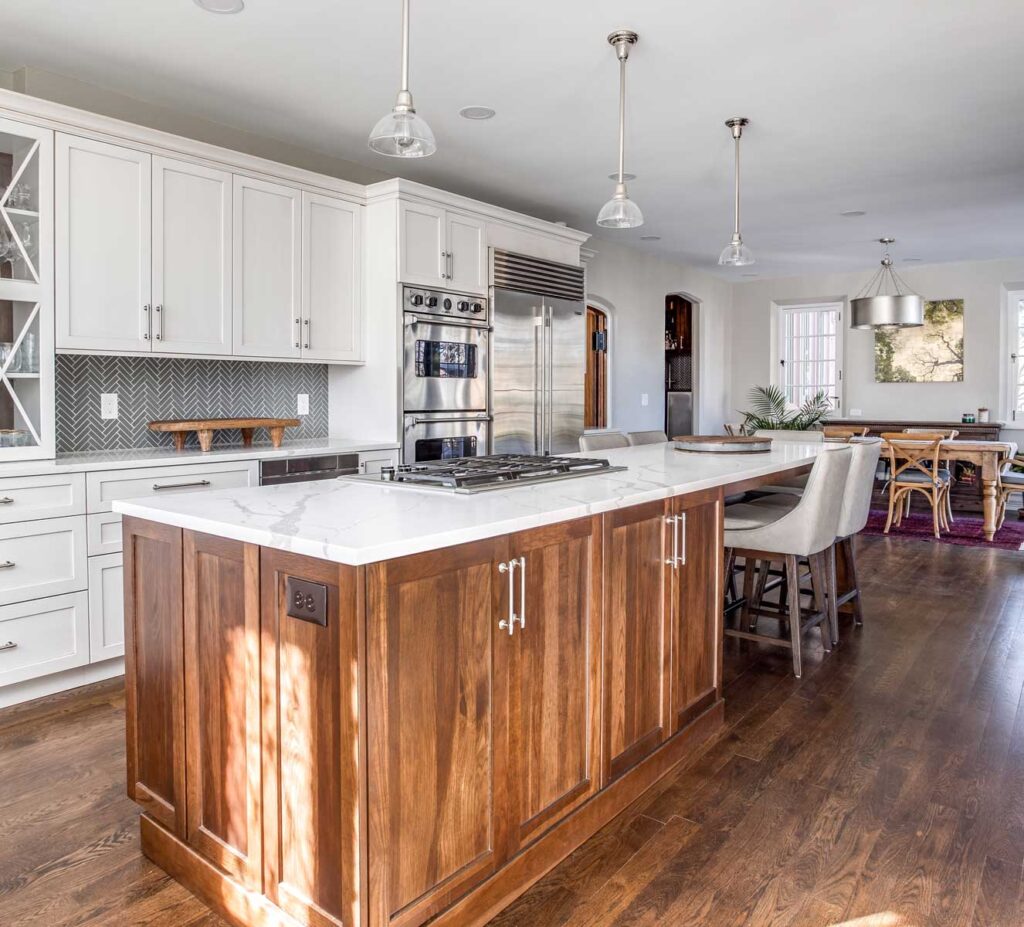 open concept kitchen with lots of white cabinets and updated appliances JM Kitchen & Bath Design