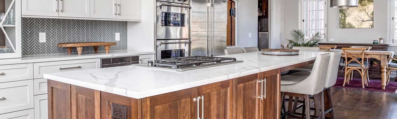 open concept kitchen with lots of white cabinets and updated appliances JM Kitchen & Bath Design