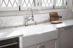 farm sink and natural light are features in kitchen remodel JM Kitchen & Bath Design