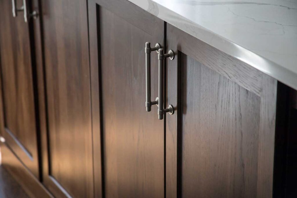 close up of brushed nickel hardware for kitchen cabinets JM Kitchen & Bath Design