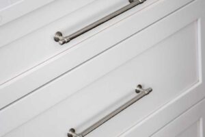 close up of hardware on white drawers in remodeled kitchen JM Kitchen & Bath Design