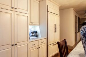 remodeled kitchen with country feel has off white custom cabinets and coffee nook JM Kitchen & Bath Design