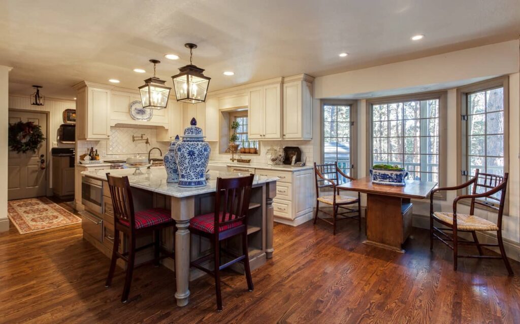 kitchen and breakfast nook remodel with lantern lights and oversized chairs JM Kitchen & Bath Design