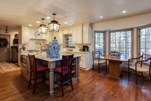 kitchen and breakfast nook remodel with lantern lights and oversized chairs JM Kitchen & Bath Design