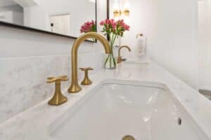 matte brass fixtures in newly remodeled bathroom JM Kitchen & Bath Design