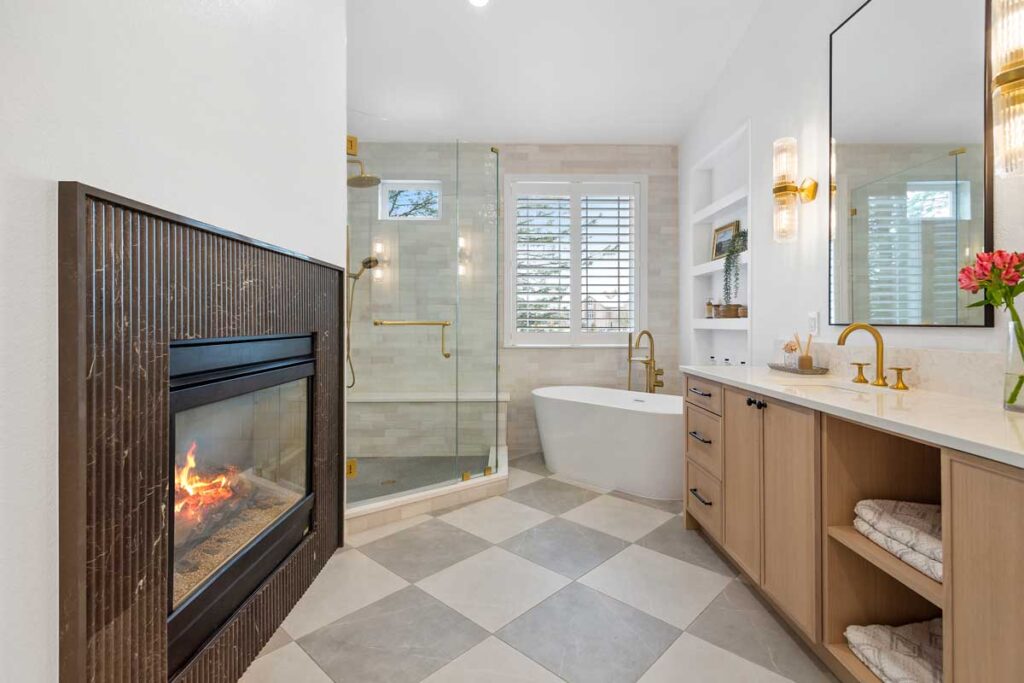 fireplace is featured in remodeled bathroom JM Kitchen & Bath Design