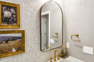 bathroom remodel highlights dark brass finishes JM Kitchen & Bath Design