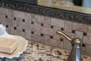 close up of tile and mirror border on new bathroom remodel JM Kitchen & Bath Design