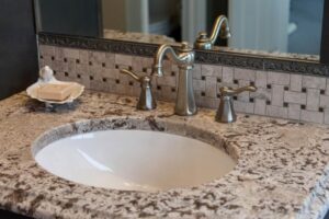 close up of vanity and faucet in remodeled bathroom from JM Kitchen & Bath Design