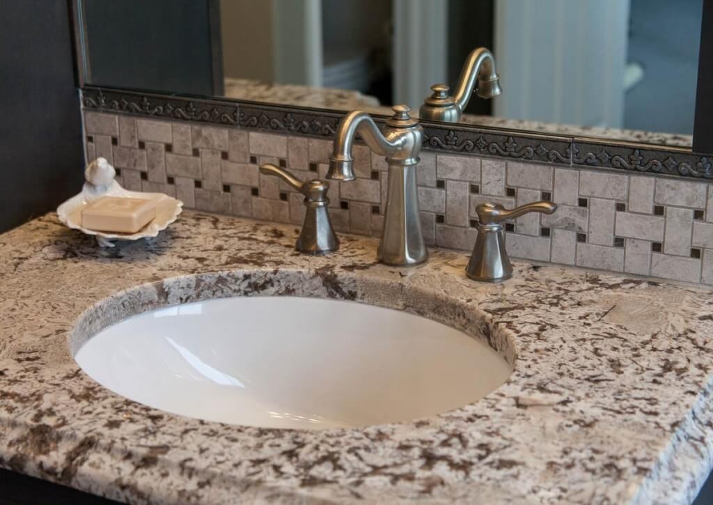 close up of vanity and faucet in remodeled bathroom from JM Kitchen & Bath Design