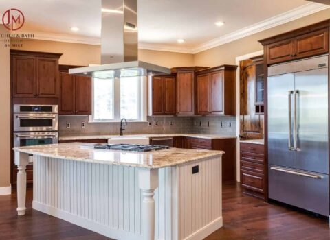 modern and farmhouse feel kitchen remodel with white island and darker wood cabinets JM Kitchen & Bath Design