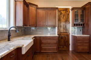 JM Kitchen & Bath Design remodeled kitchen with apron sink and darker cabinets JM Kitchen & Bath Design