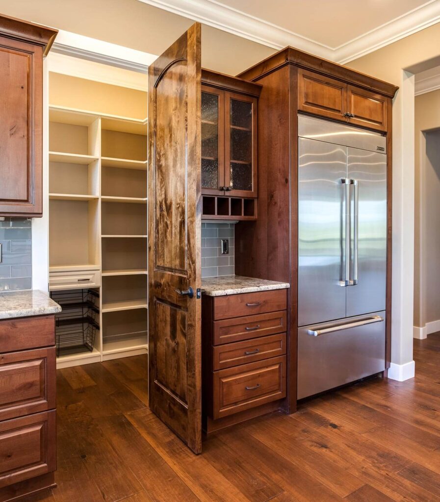 custom kitchen remodel features a walk in pantry with lots of shelf space JM Kitchen & Bath Design