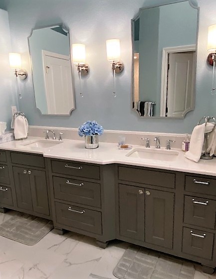 remodeled bathroom features dual sinks and new cabinets JM Kitchen & Bath Design