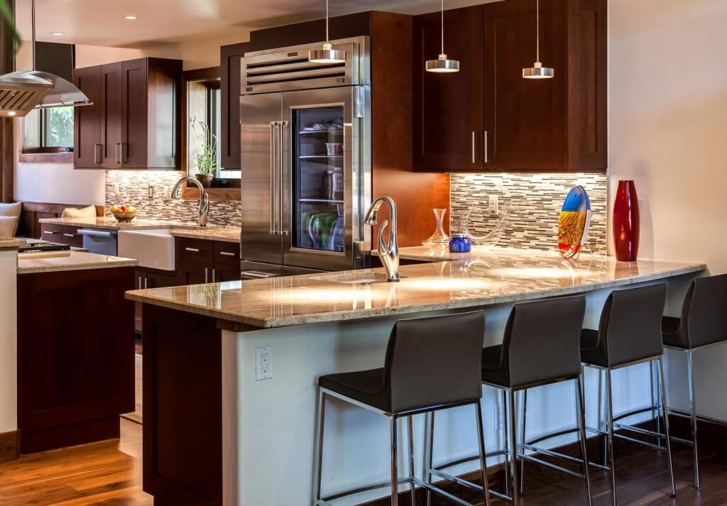 remodeled kitchen from JM Kitchen & Bath Design featuring new bar, countertops, cabinets, appliances and lighting