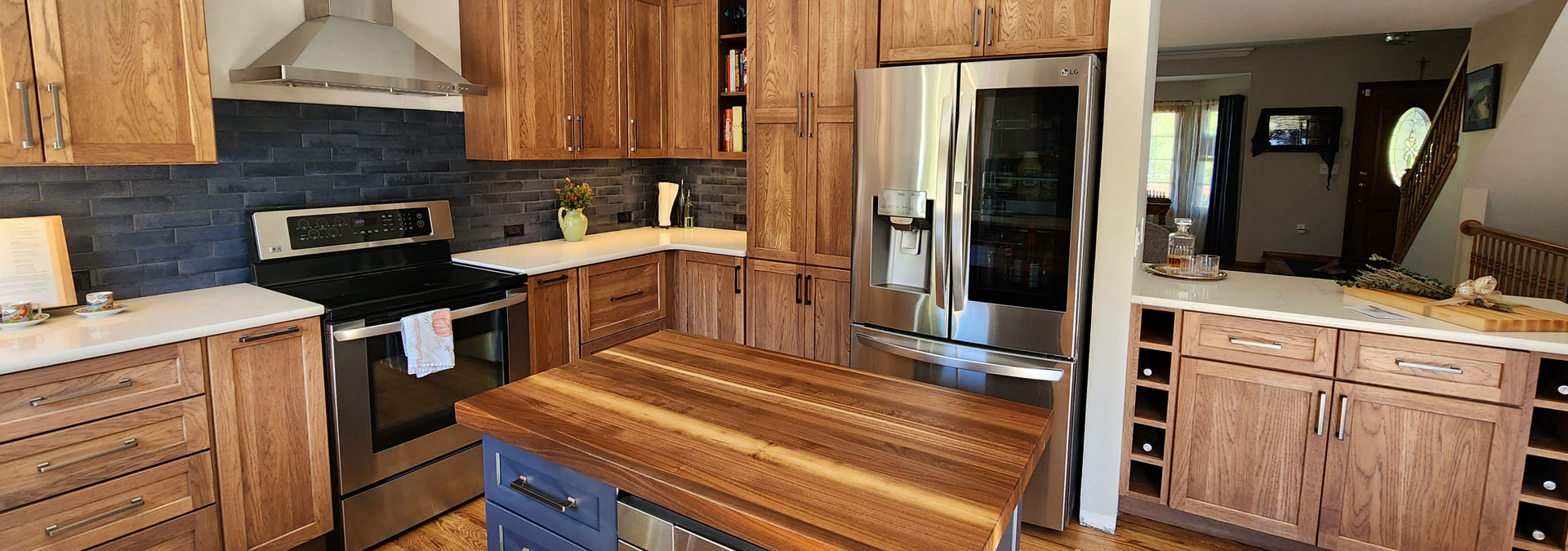 large kitchen remodel with wood finishes JM Kitchen & Bath Design