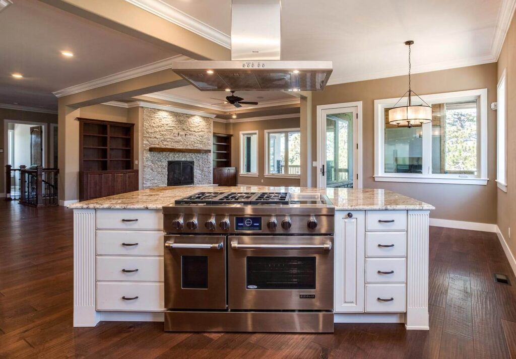 remodeled open concept kitchen is a modern, farm style with upgraded appliances and white cabinets JM Kitchen & Bath Design