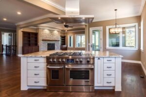 remodeled open concept kitchen is a modern, farm style with upgraded appliances and white cabinets JM Kitchen & Bath Design