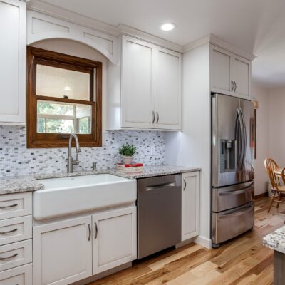 White painted cabinets with granite countertops JM Kitchen & Bath Design