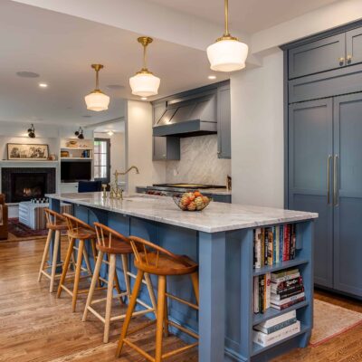 Muted blue painted cabinets with gold accents JM Kitchen & Bath Design