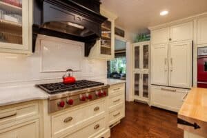 Off white painted cabinets with marble countertop JM Kitchen & Bath Design