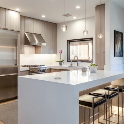 Minimalistic kitchen with light grey cabinets JM Kitchen & Bath Design