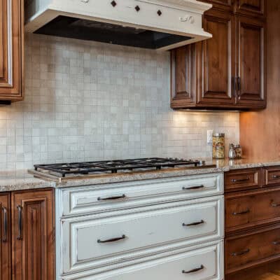 Range Hood is a Vent-A-Hood Liner with the surround made by Crystal Cabinetry JM Kitchen & Bath Design